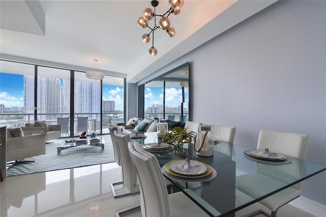 dining area featuring tile patterned flooring, a notable chandelier, plenty of natural light, and a wall of windows