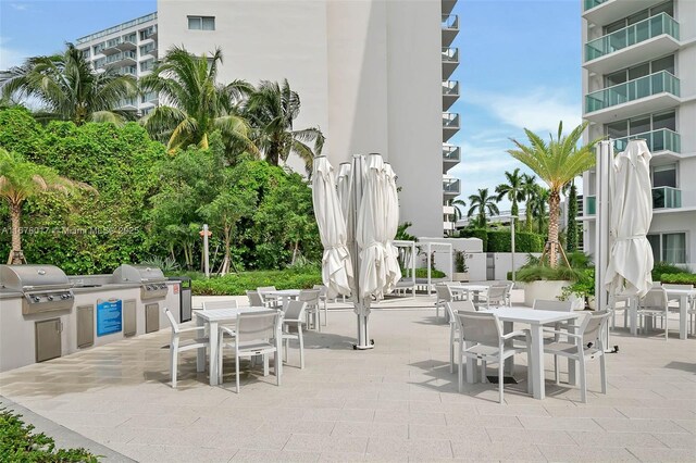 view of patio / terrace featuring a water view and a pergola