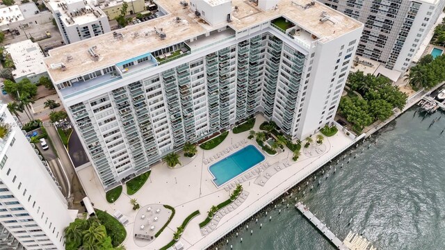 birds eye view of property with a water view