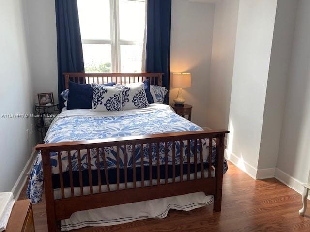 bedroom featuring wood-type flooring