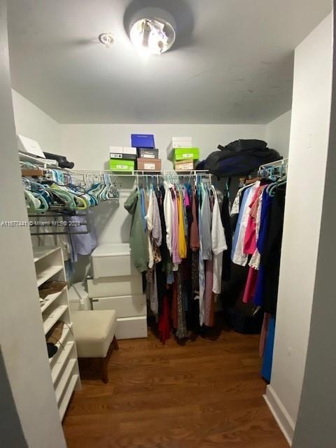 50 Menores Ave Unit 829, Coral Gables, FL 33134 - walk in closet featuring wood finished floors