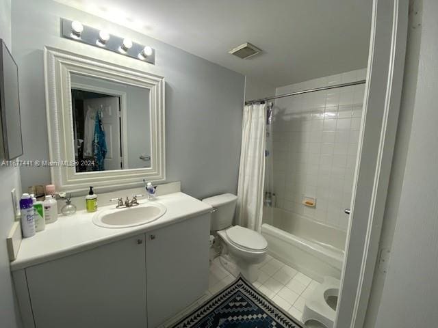 full bathroom featuring toilet, shower / tub combo with curtain, vanity, and tile patterned flooring