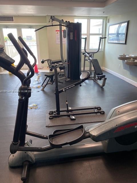 workout area featuring plenty of natural light