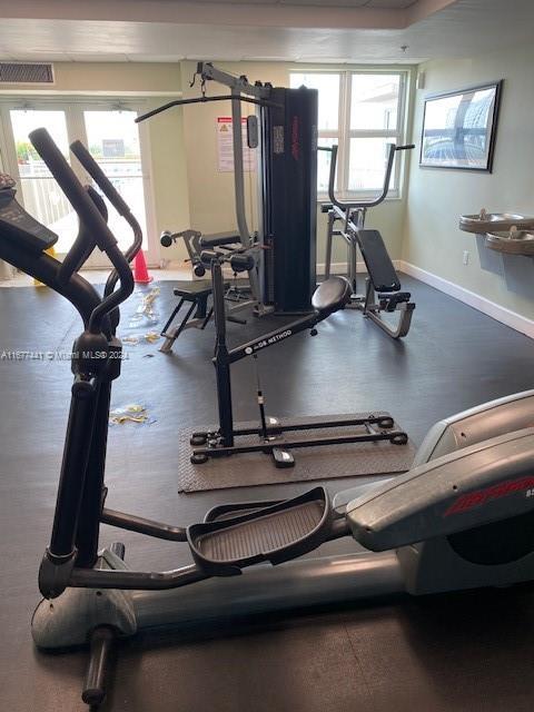 50 Menores Ave Unit 829, Coral Gables, FL 33134 - workout room with healthy amount of natural light and baseboards