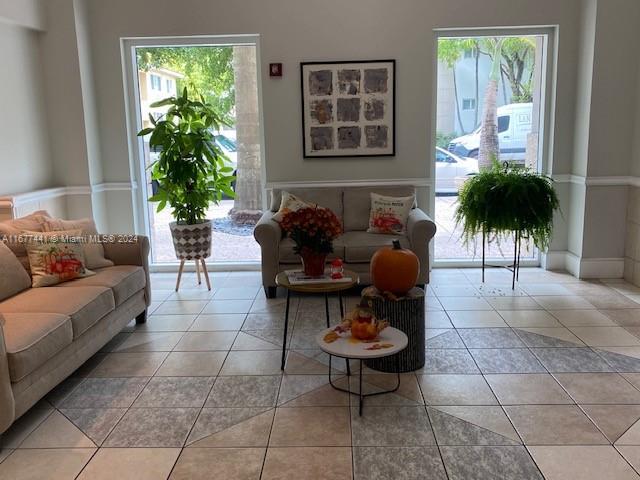 50 Menores Ave Unit 829, Coral Gables, FL 33134 - living room featuring plenty of natural light and light tile patterned floors