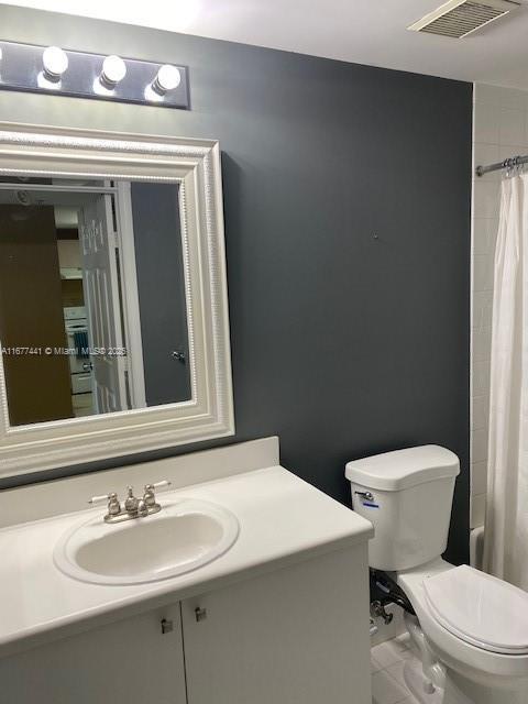 50 Menores Ave Unit 829, Coral Gables, FL 33134 - full bathroom with vanity and a shower with curtain