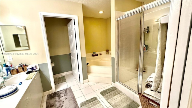 bathroom featuring vanity, plus walk in shower, and tile patterned flooring