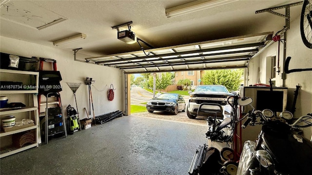 garage featuring a garage door opener