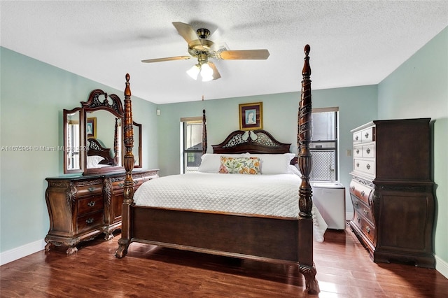 bedroom featuring wood-type flooring, ceiling fan, and a textured ceiling