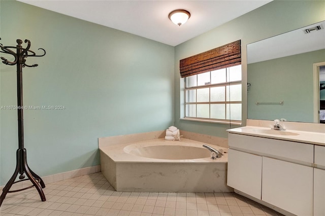 bathroom with tile patterned flooring, vanity, and a tub