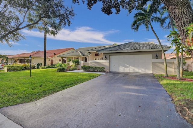 view of front facade featuring a garage and a front yard