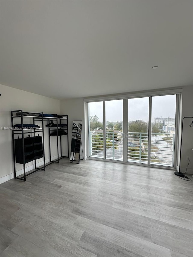 empty room with a wealth of natural light and a wall of windows