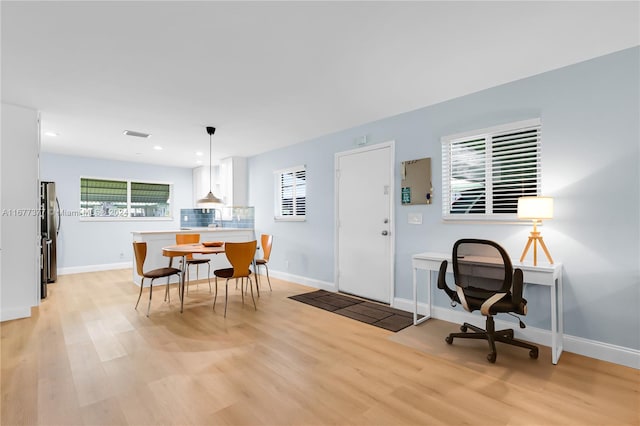 dining room with light wood-type flooring