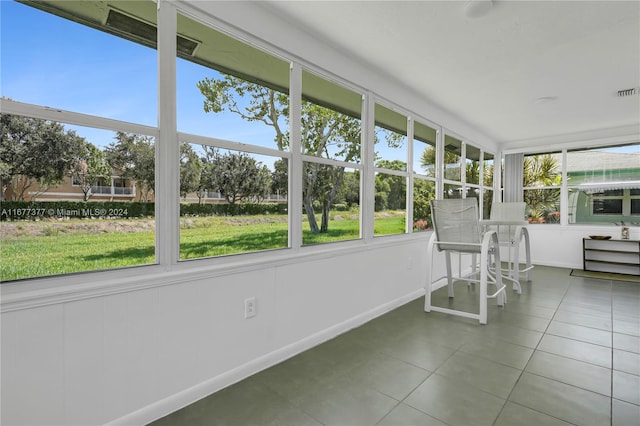 unfurnished sunroom with plenty of natural light