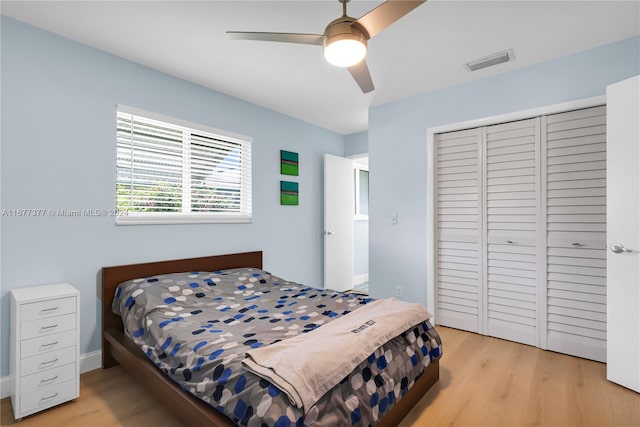 bedroom featuring light hardwood / wood-style floors and ceiling fan