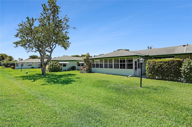 view of yard featuring a sunroom