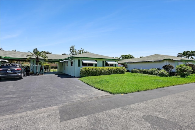 ranch-style home with a front yard