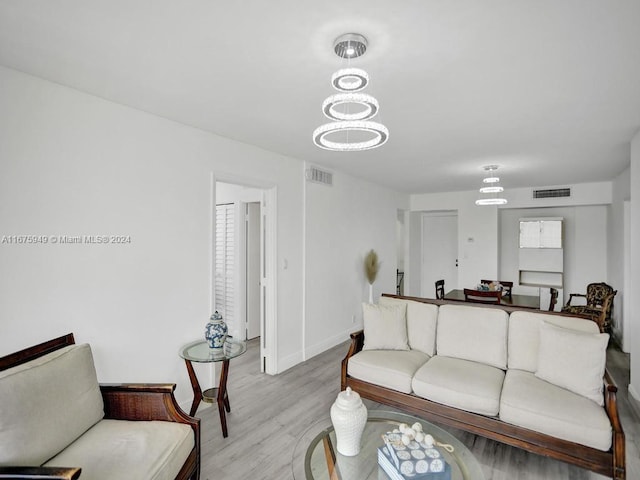 living room with light hardwood / wood-style flooring