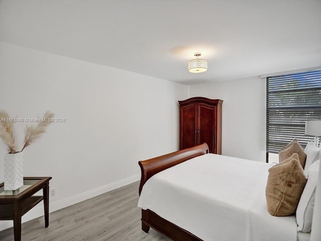 bedroom featuring light wood-type flooring