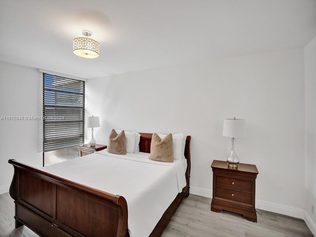 bedroom with light hardwood / wood-style floors