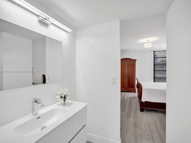 bathroom featuring vanity and hardwood / wood-style floors