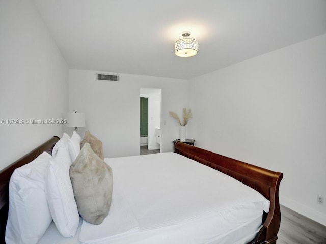 20400 W Country Club Dr Unit 301, Aventura, FL 33180 - bedroom with wood finished floors and baseboards