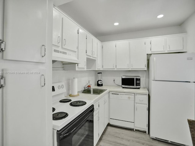 kitchen featuring white cabinetry, light hardwood / wood-style floors, sink, ventilation hood, and white appliances