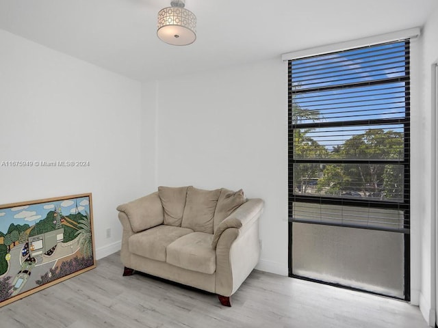 sitting room with light hardwood / wood-style floors