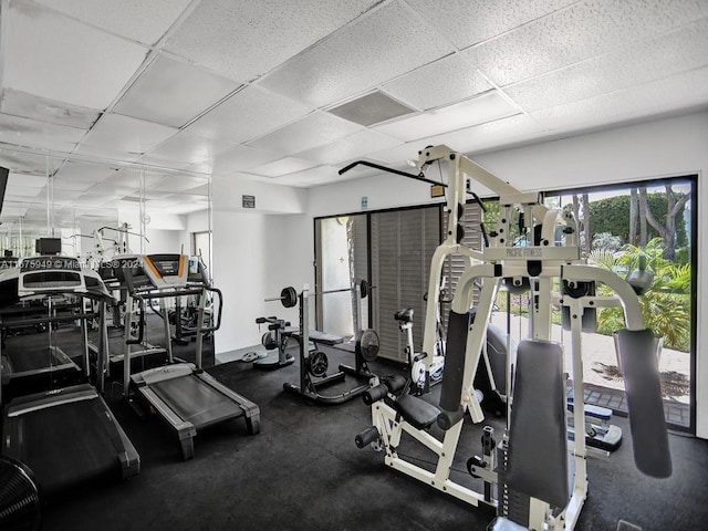 exercise room featuring a paneled ceiling