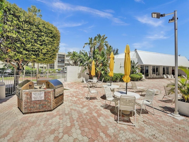 20400 W Country Club Dr Unit 301, Aventura, FL 33180 - view of patio featuring a grill, area for grilling, and fence