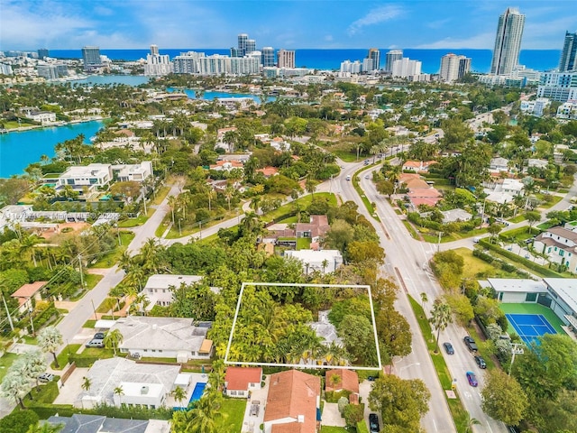 birds eye view of property with a water view