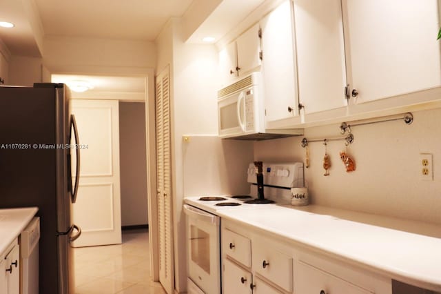 kitchen with white cabinets and white appliances