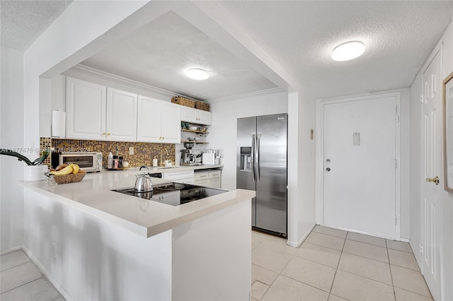 kitchen featuring kitchen peninsula, white cabinets, backsplash, a textured ceiling, and stainless steel refrigerator with ice dispenser