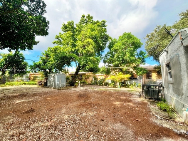 view of yard with a storage shed and central air condition unit