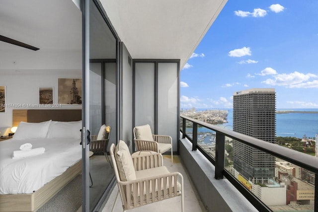 balcony featuring a water view