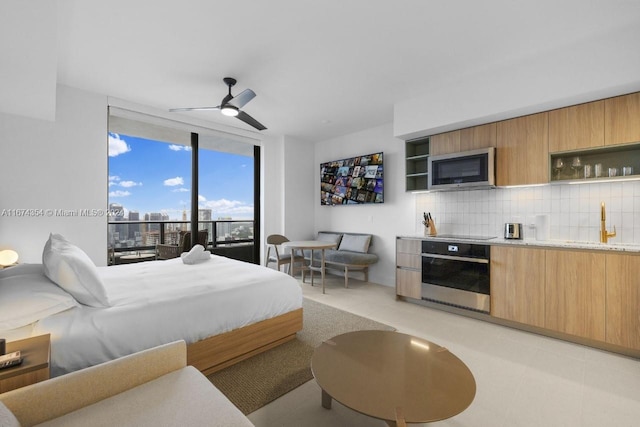 bedroom with sink and ceiling fan