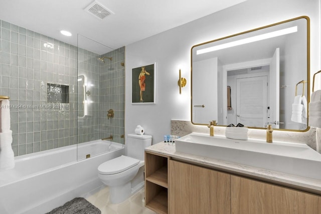 full bathroom featuring vanity, toilet, tile patterned flooring, and tiled shower / bath