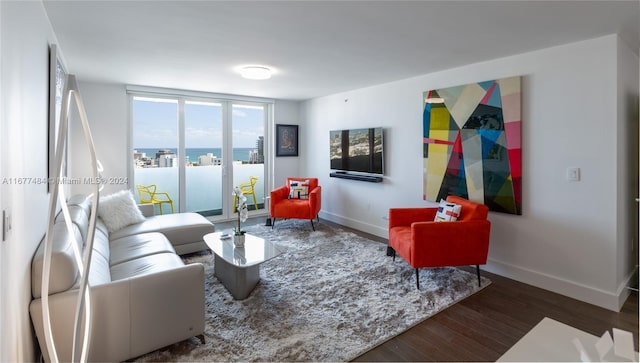 living room with wood finished floors and baseboards