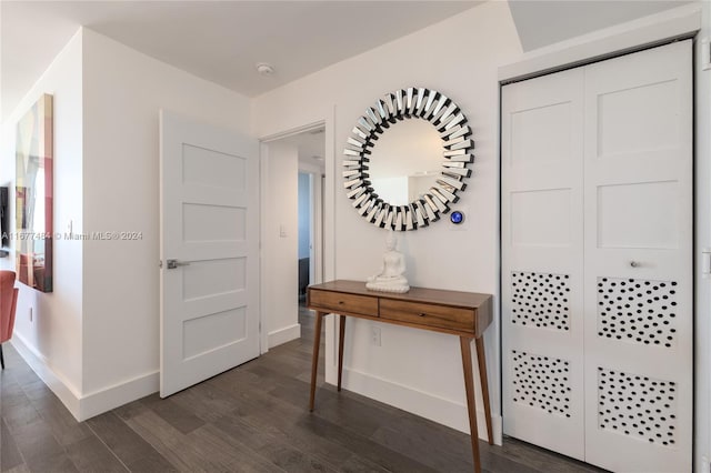 entrance foyer featuring dark wood-style floors and baseboards