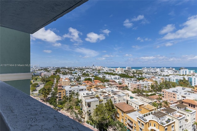 exterior space with a city view and a water view