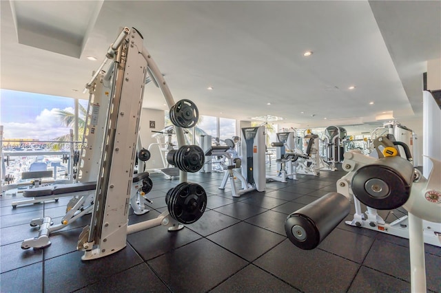 exercise room with recessed lighting and expansive windows