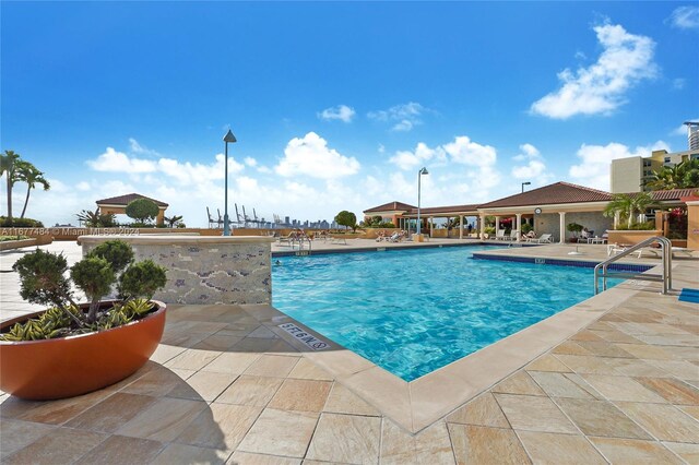 view of swimming pool featuring a patio area