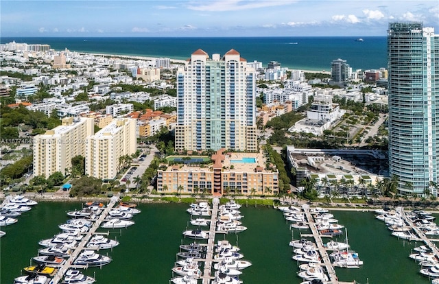 drone / aerial view featuring a view of city and a water view