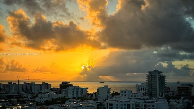 property's view of city featuring a water view