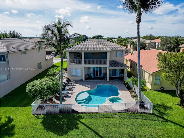 view of pool featuring a yard and a patio area