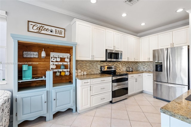 kitchen featuring ornamental molding, appliances with stainless steel finishes, white cabinetry, and light tile patterned flooring