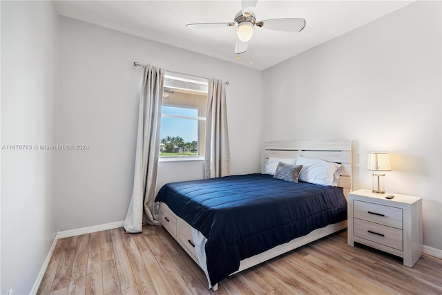 bedroom with light wood-type flooring and ceiling fan