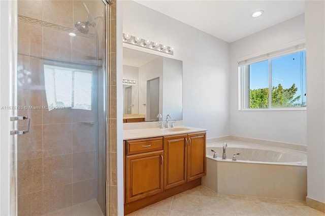 bathroom with vanity, shower with separate bathtub, and tile patterned floors