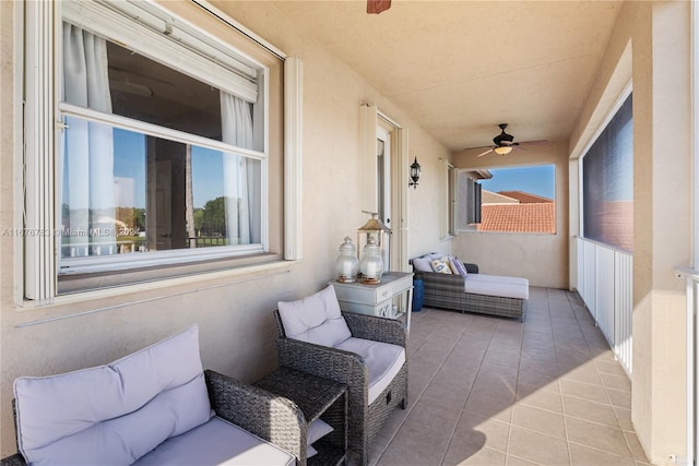 exterior space featuring ceiling fan and an outdoor hangout area