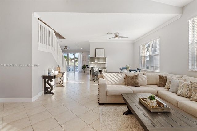 living room with ceiling fan, a healthy amount of sunlight, and light tile patterned floors